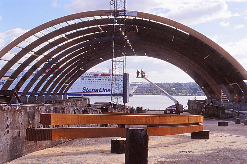 Ship yard building with two of the first ribs to be raised